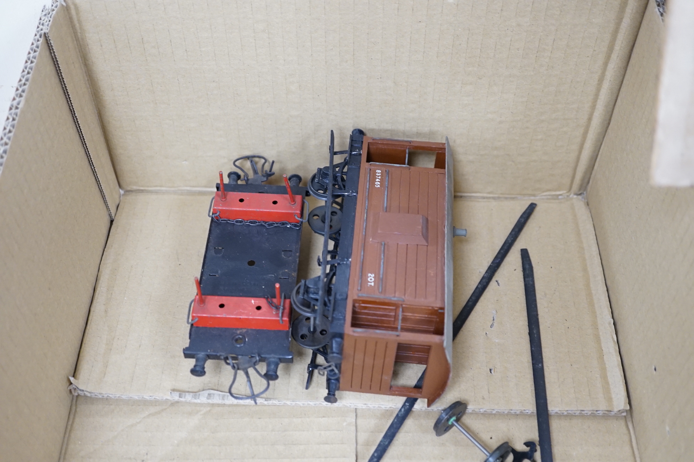 Twenty-five 0 gauge items, including; a kit built clockwork 4-4-2T locomotive with brass body and sprung buffers, together with a kit built Southern Railway bogie coach, a six wheel parcel van and a guard’s van, twenty b